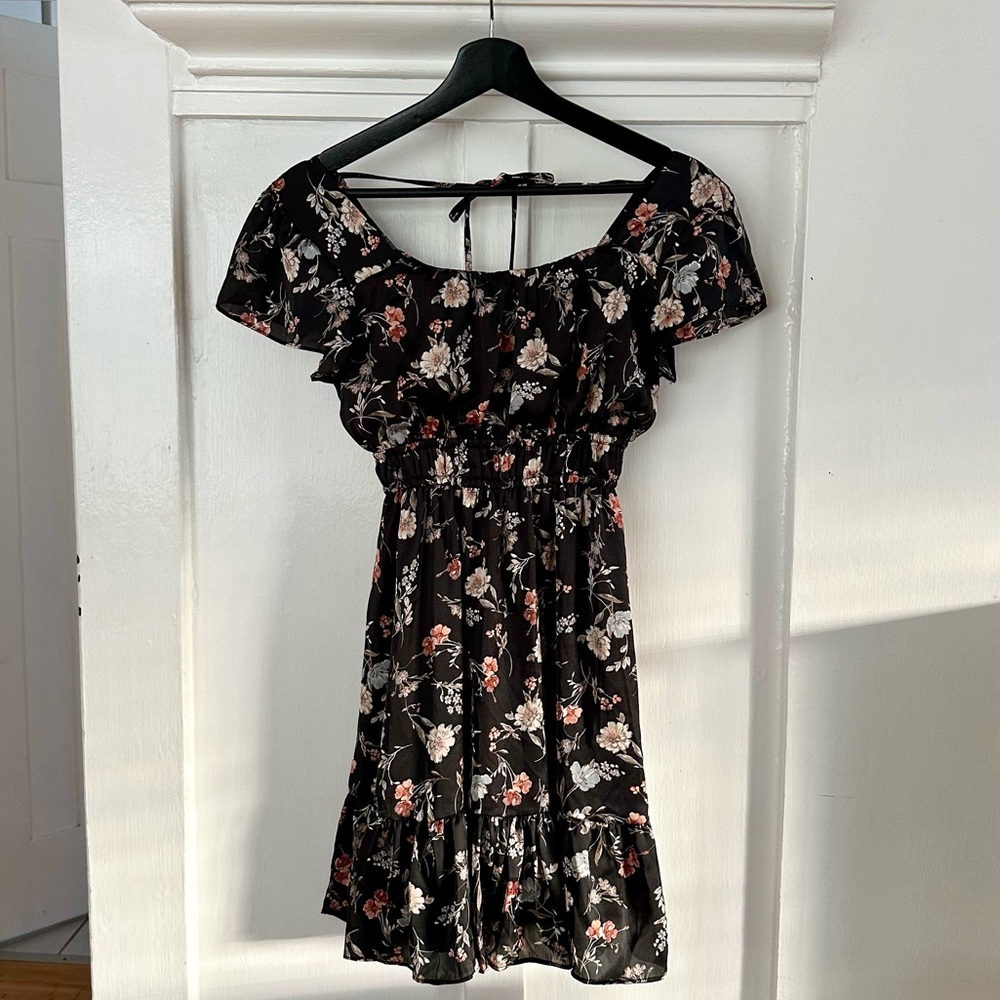 NWT Altar’d State black floral mini dress with ruffle sleeves and tie back.